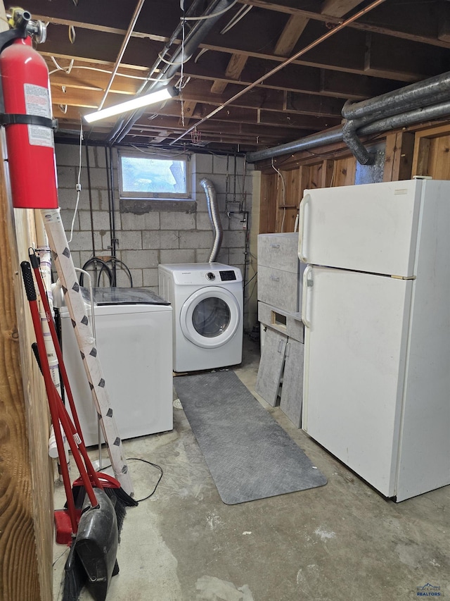 laundry area with washing machine and dryer