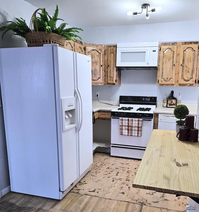 kitchen featuring white appliances and light wood-type flooring