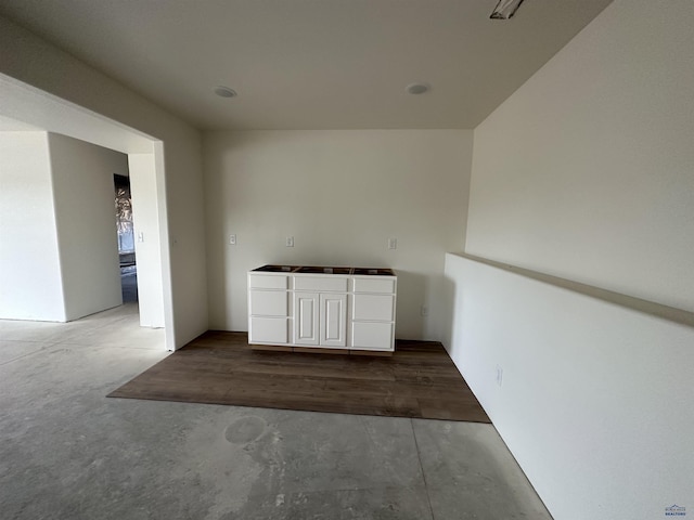 interior space featuring unfinished concrete floors