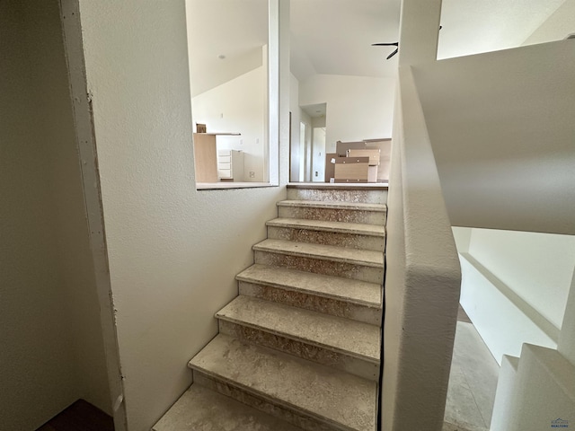 stairway with a textured wall