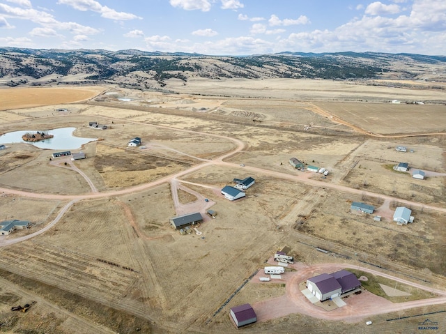 aerial view featuring a mountain view and a rural view