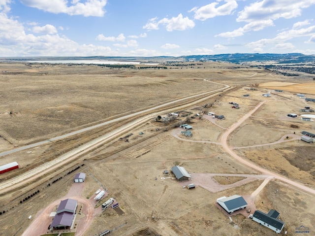 bird's eye view featuring a mountain view and a rural view