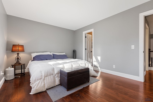 bedroom featuring dark hardwood / wood-style flooring