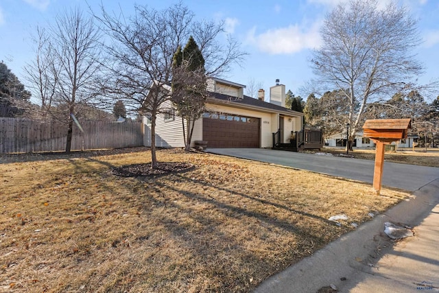 view of side of home with a garage