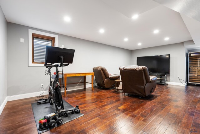 exercise room with dark hardwood / wood-style floors