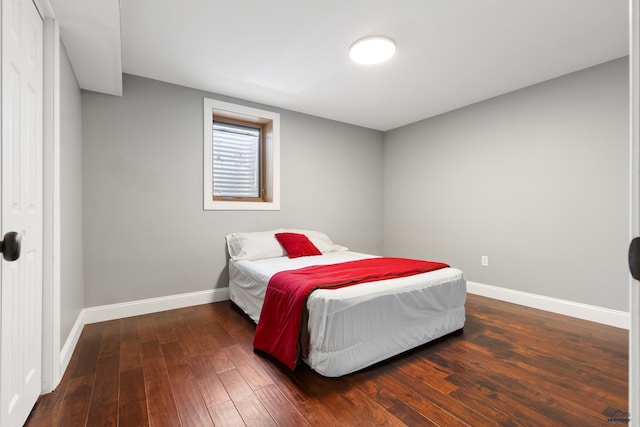 bedroom featuring dark wood-type flooring