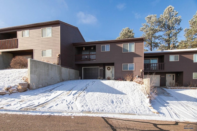 view of front of house with a balcony and a garage