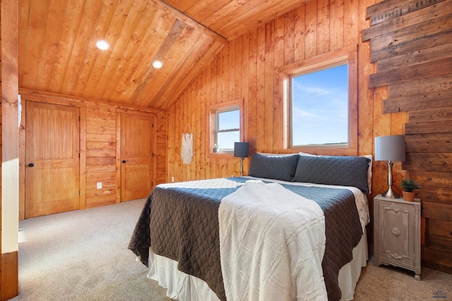 bedroom with wooden ceiling, carpet floors, wooden walls, and vaulted ceiling