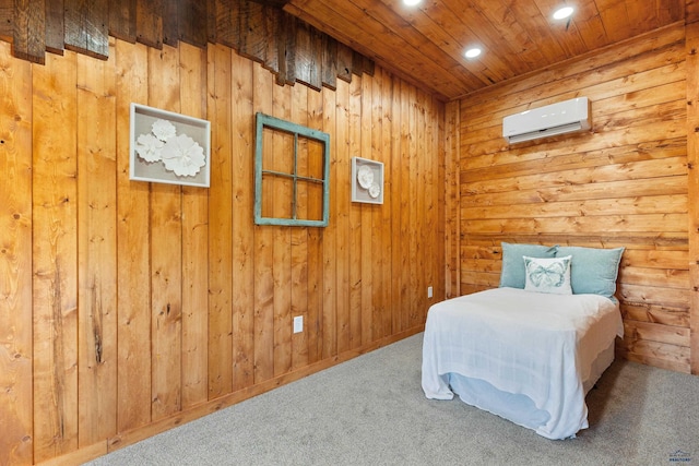 carpeted bedroom featuring a wall mounted AC and wood walls