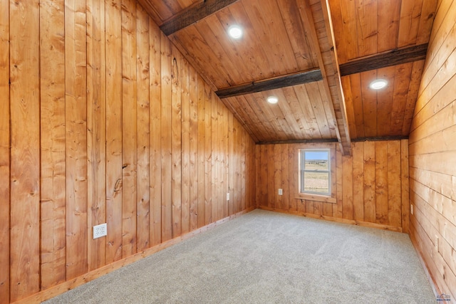 additional living space featuring carpet flooring, vaulted ceiling with beams, wooden walls, and wood ceiling