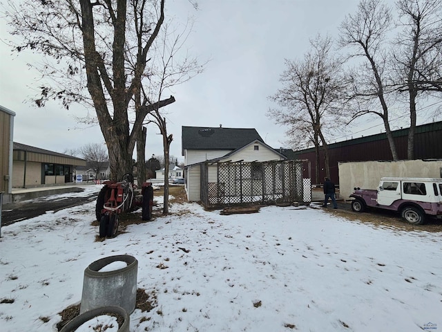 view of yard layered in snow