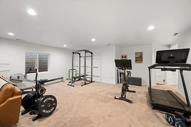 workout room featuring light colored carpet