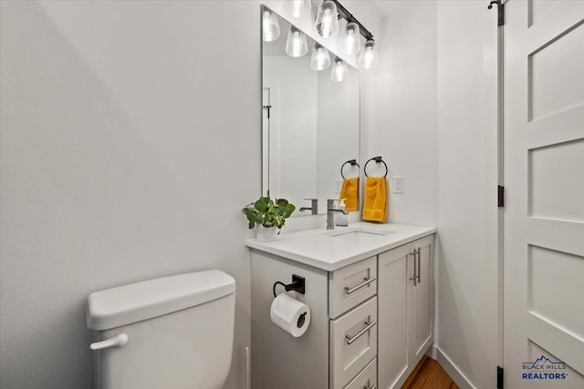 bathroom with vanity and toilet