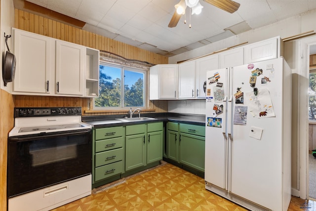 kitchen with white appliances, white cabinets, sink, green cabinetry, and ceiling fan