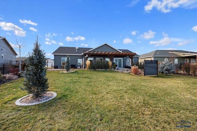 rear view of house with a pergola and a yard