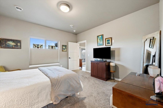 bedroom with light colored carpet