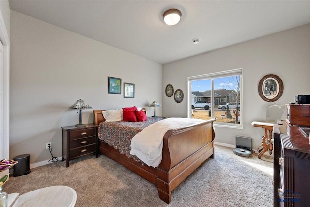 bedroom featuring light colored carpet