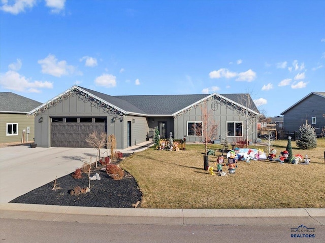 view of front of house with a garage and a front yard