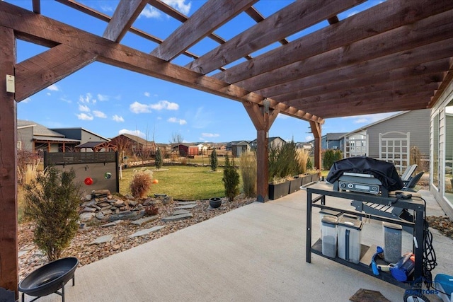 view of patio / terrace featuring a pergola and exterior kitchen