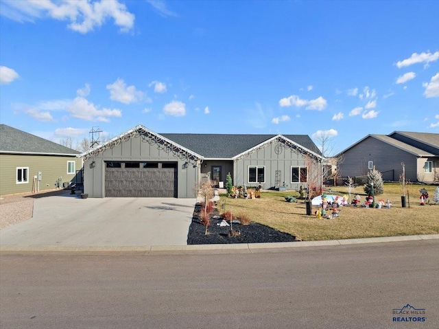 view of front facade featuring a garage and a front lawn