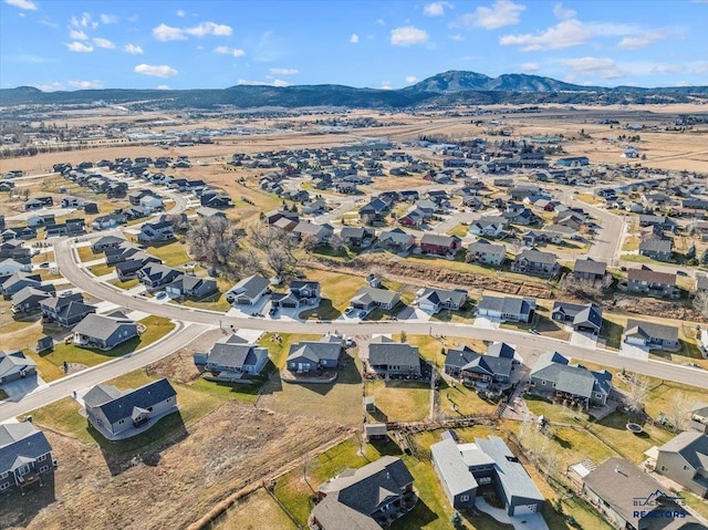 birds eye view of property with a mountain view