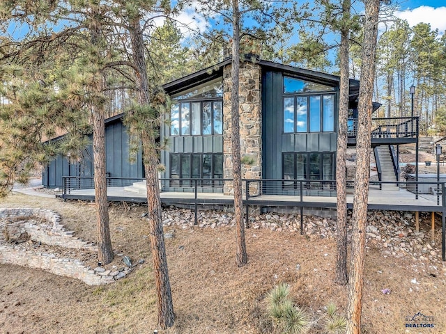 view of side of home featuring a deck