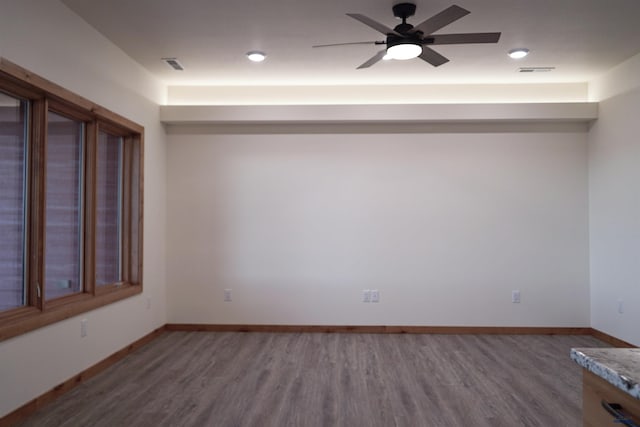 spare room featuring ceiling fan and hardwood / wood-style floors