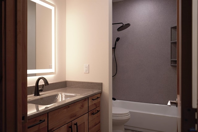 full bathroom with vanity, toilet, and  shower combination