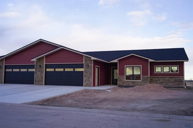 ranch-style house featuring a garage