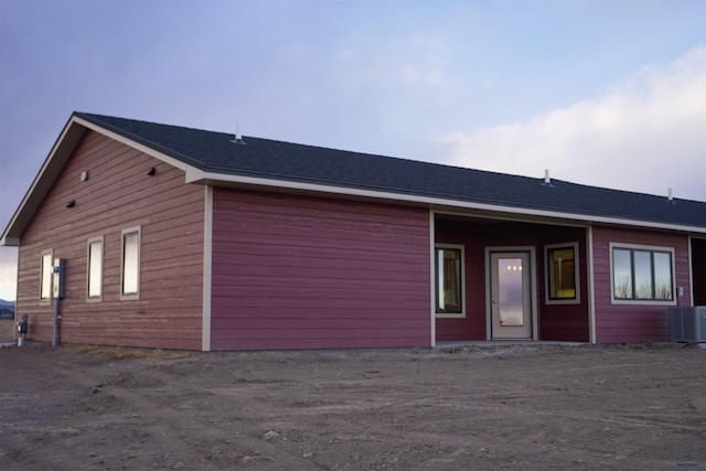 ranch-style house with cooling unit