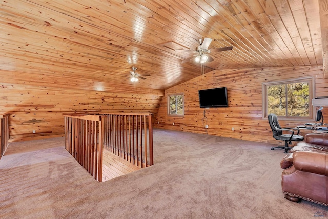 office space featuring ceiling fan, wooden walls, wood ceiling, and vaulted ceiling