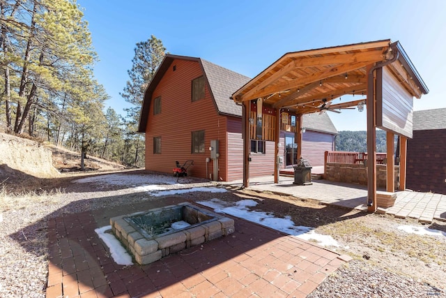 back of property featuring a patio