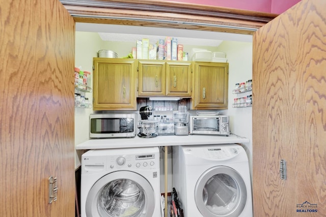 washroom with washing machine and dryer