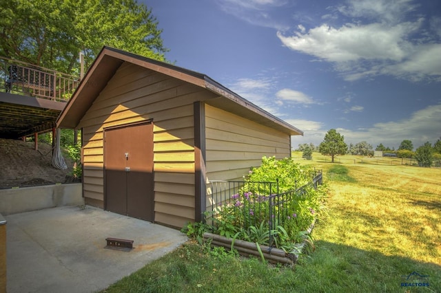 view of outdoor structure with a lawn