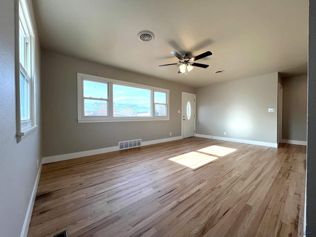 unfurnished room featuring light hardwood / wood-style flooring and ceiling fan