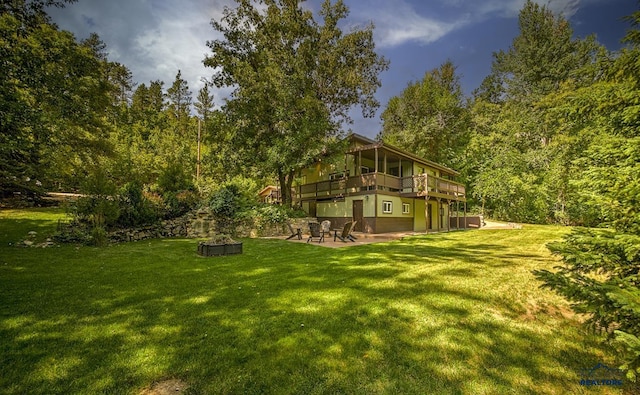 view of yard with a deck and a patio area