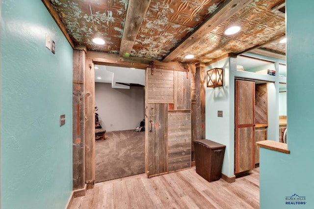 hallway with hardwood / wood-style floors