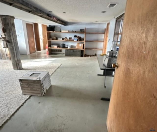 basement with a textured ceiling