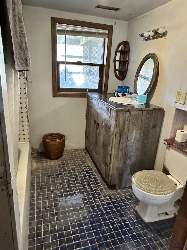 full bathroom with vanity, separate shower and tub, and toilet