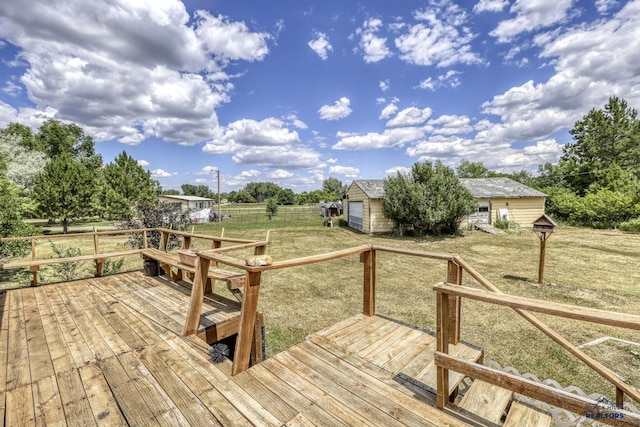 wooden deck with an outbuilding and a lawn