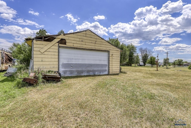 garage featuring a yard