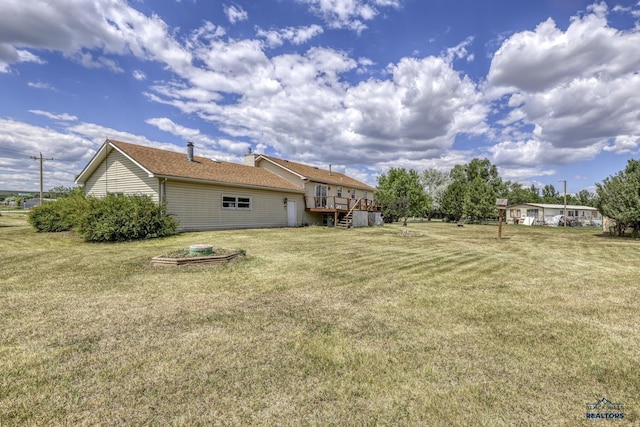 view of yard featuring a wooden deck