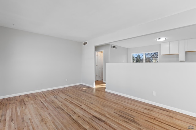 spare room featuring light hardwood / wood-style flooring