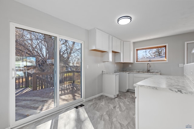 kitchen with white cabinets and sink