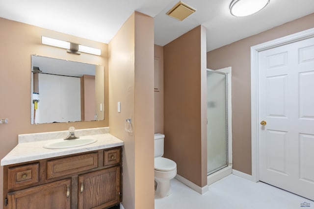 bathroom featuring vanity, toilet, and walk in shower