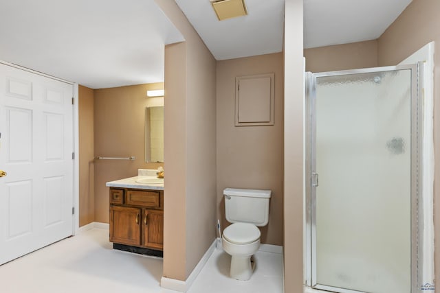 bathroom featuring vanity, toilet, and walk in shower