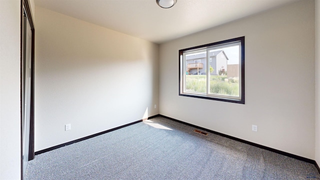 empty room featuring carpet floors