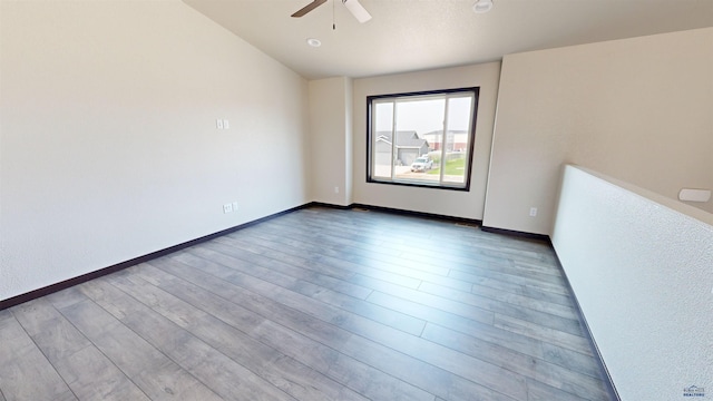 unfurnished room featuring ceiling fan and light hardwood / wood-style flooring