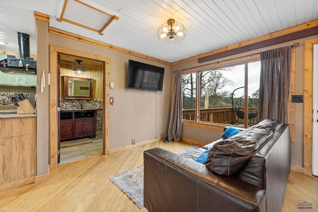 interior space featuring a chandelier, wooden ceiling, crown molding, and light hardwood / wood-style floors