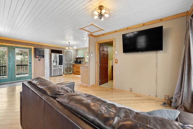 living room featuring light hardwood / wood-style floors, wooden ceiling, a chandelier, and ornamental molding